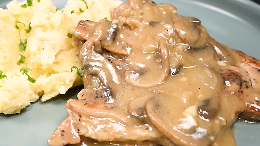 smothered pork chops in an amazing mushroom gravy recipe